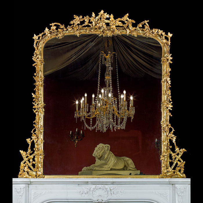  An English gilded oak and ivy decorated over mantel mirror   