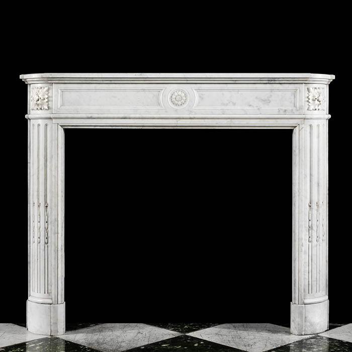 A Louis XVI Style Carrara Marble Fireplace