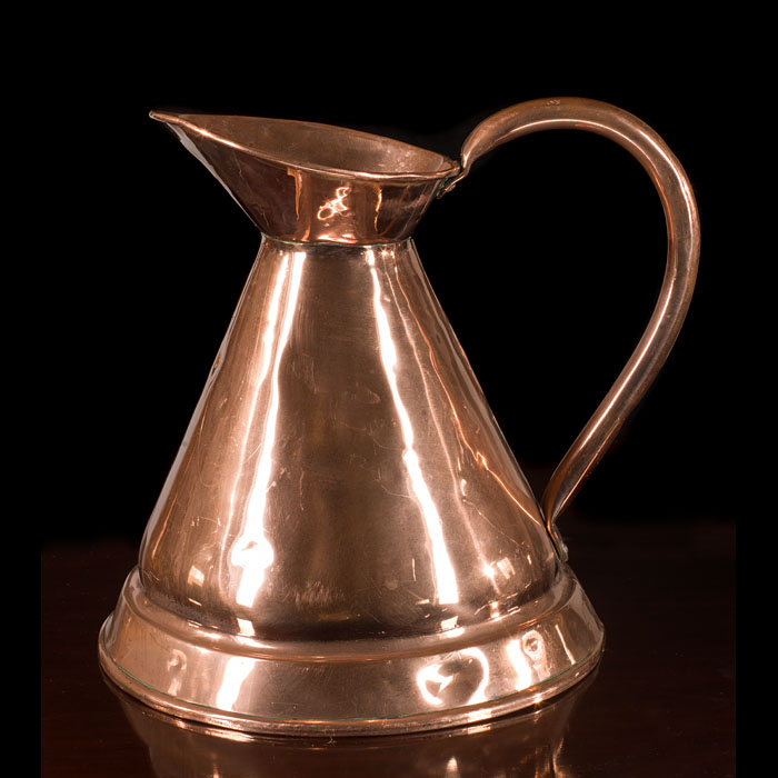 Two traditional Victorian copper pouring jugs