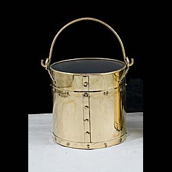 A 1930's studded brass coal or log bin    