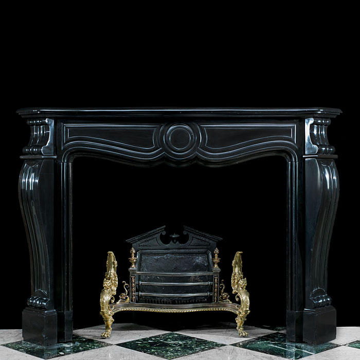 A Belgian Black Marble Rococo style Fireplace Mantel    