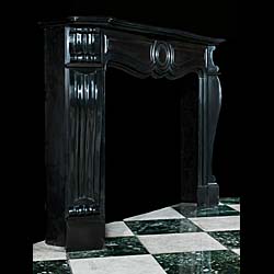 A Belgian Black Marble Rococo style Fireplace Mantel    