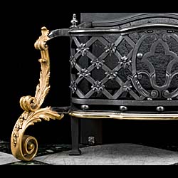 A large Rococo style cast iron and ormolu fire basket 