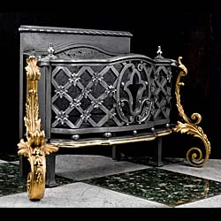 A large Rococo style cast iron and ormolu fire basket 