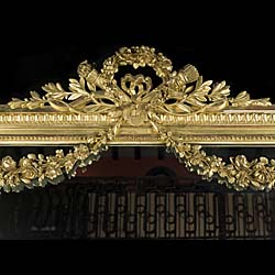 A Tall French Gilded Overmantel Mirror.