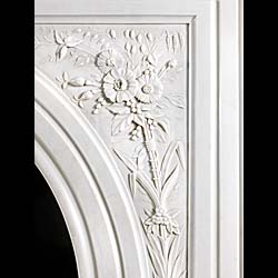 A white marble antique arched Victorian fireplace 