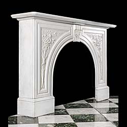 A white marble antique arched Victorian fireplace 