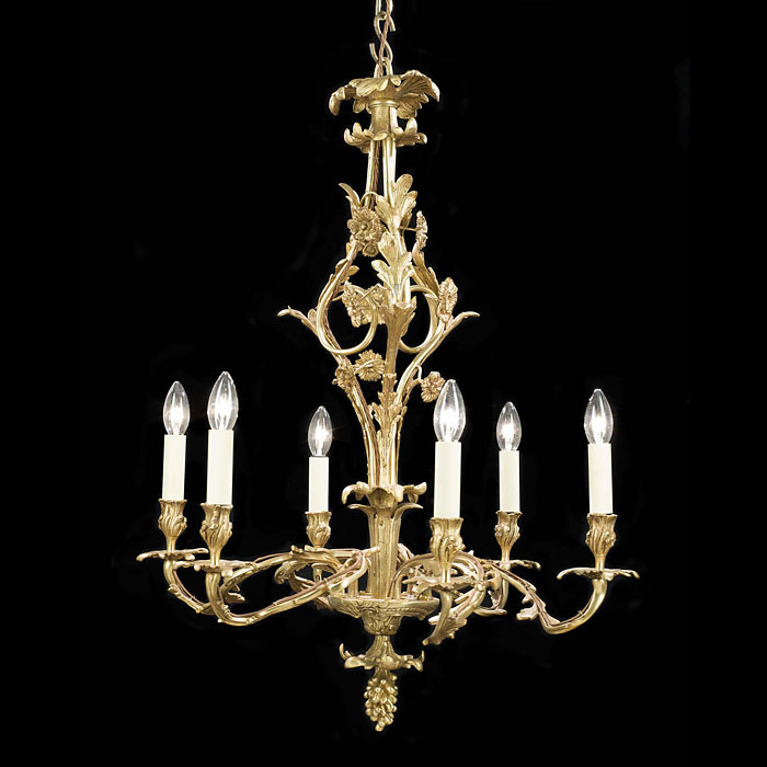 A Six Light Brass Antique French Chandelier