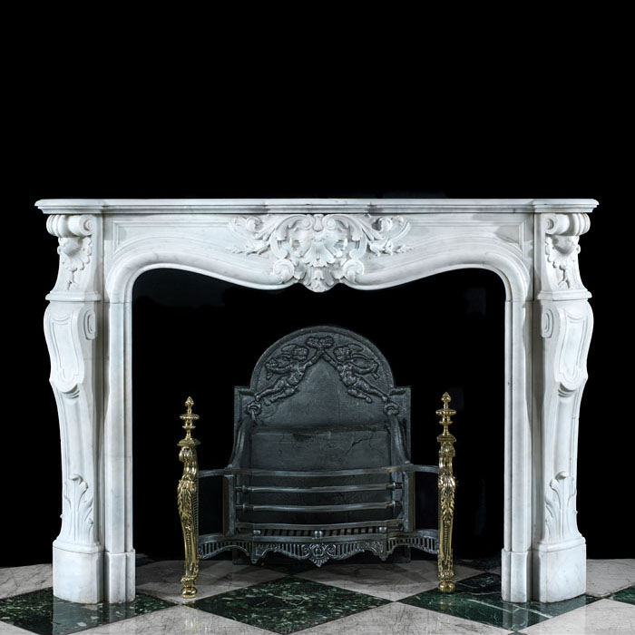 A Louis XV Style Carrara Marble Fireplace