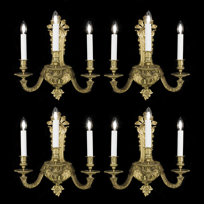 A Regency style set of four brass wall lights