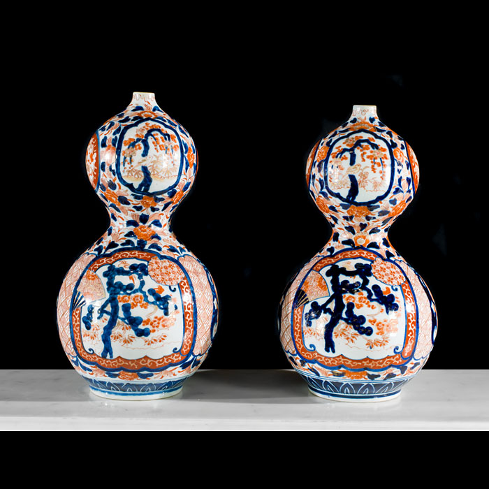 A pair of Meiji Period hand painted vases