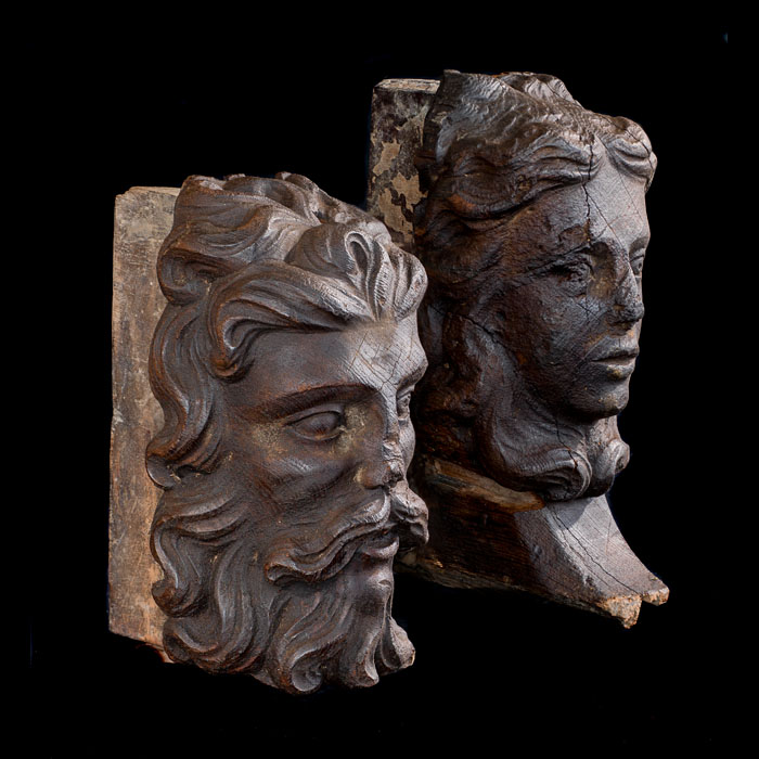 A pair of oak heads of Jacobean nobility