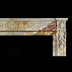 Antique Louis XVI Marble Regency fireplace with carved floral Cartouche
 This large figured Marble Regency Chimneypiece has a breakfronted shelf  with a simple frieze. The central floral Cartouche is highly carved and is flanked by floral Paterae carved into the endblocks. The substantial jambs are adorned with Acanthus leaf detail with scrolled consoles. French 19th century.
