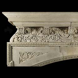 Antique Rare Renaissance Inglenook Fireplace in Limestone with ornate frieze 
 This very large limestone chimneypiece has an intricate frieze showing mythic figures, leaves and birds, surrounded by floral ornamentation. The spandrels show a wood nymph and a dolphin, surrounded by a perimeter of bellflowers and beading, with a wide arch with keystones.
