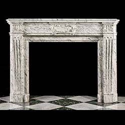 An Antique Louis XVI style chimneypiece in Arabascato marble
