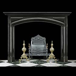 An Antique Baroque style Belgiam Black marble bolection fireplace surround