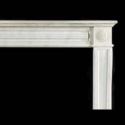 An antique statuary marble Louis XVI style chimneypiece.