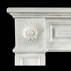 An antique statuary marble Louis XVI style chimneypiece.
