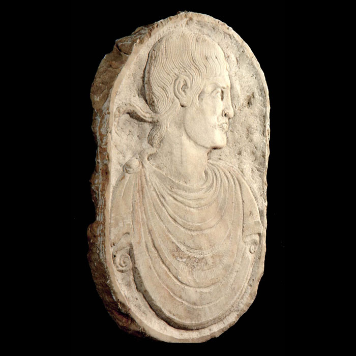 A small marble plaque of a Roman