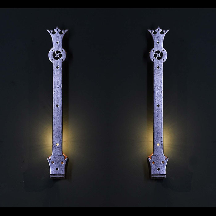 Antique 19th Century Wrought Iron Wall Lights in a Gothic manner
 This pair of Door Hinges have been converted in to Gothic manner Wrought Iron Wall Lights. 19th century.
