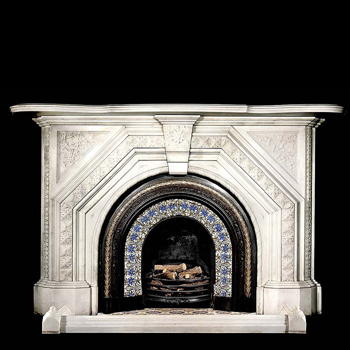 An arched statuary marble Victorian chimneypiece    