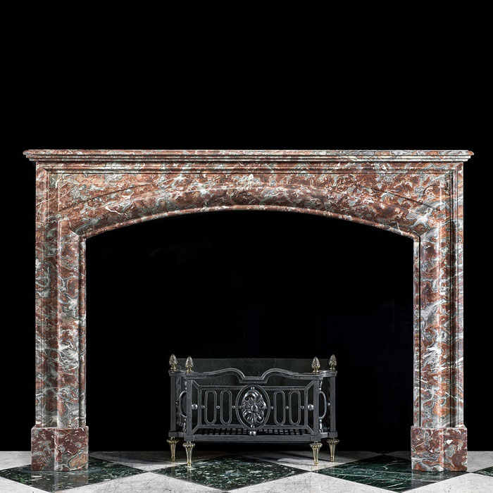 An Arched Baroque Style Marble Fireplace