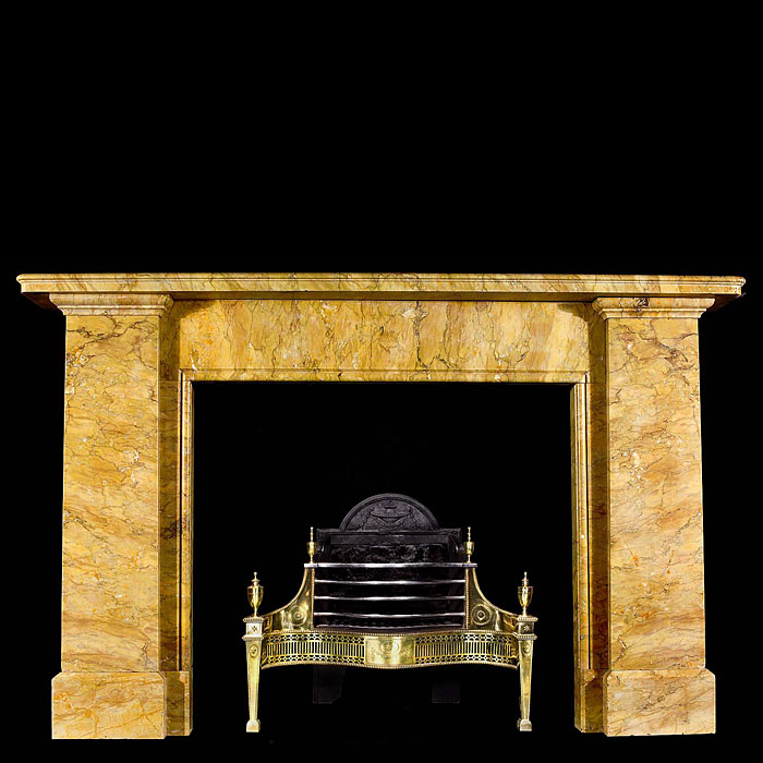 An antique Egyptian Revival Sienna Marble fireplace surround.