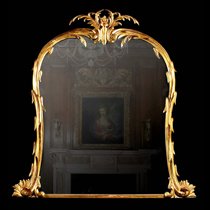  A large carved giltwood Rococo style overmantel mirror   
