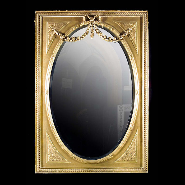A Regency style pine and gesso oval mirror
