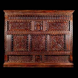 A large carved oak antique Jacobean overmantel panel    