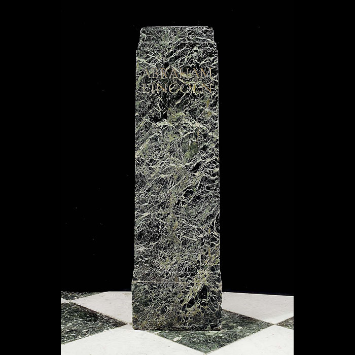 An antique marble plinth engraved with the name Abraham Lincoln    