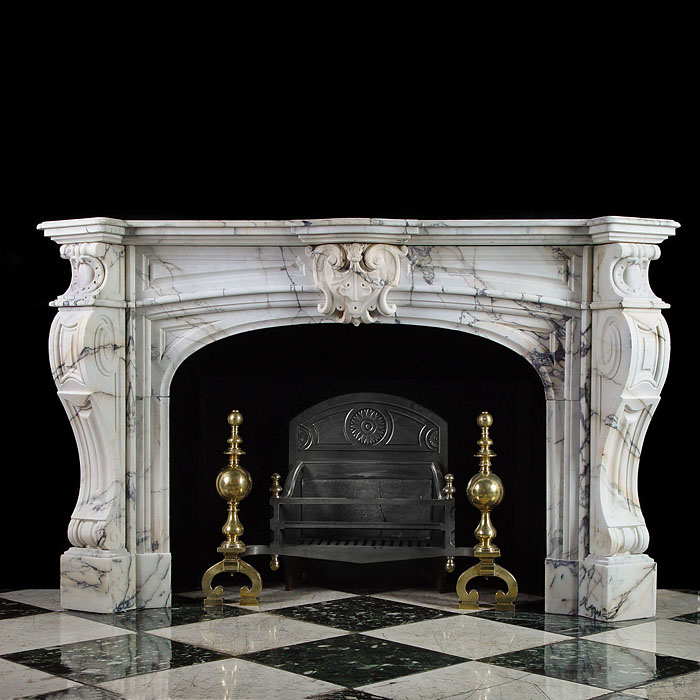A 19th century antique French Baroque Pavaonazza Marble fireplace
