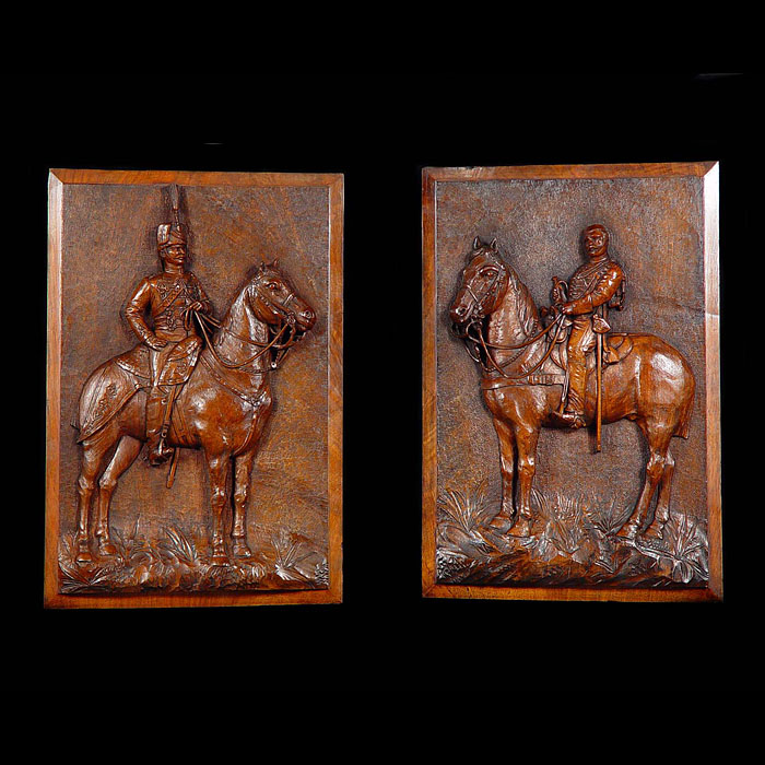 A pair of carved walnut depiction of mounted Hussars    
