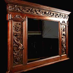 A Victorian carved oak antique over mantel mirror  