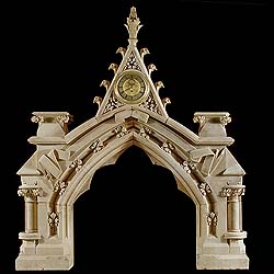  A Gothic Revival antique stone fireplace mantel.   