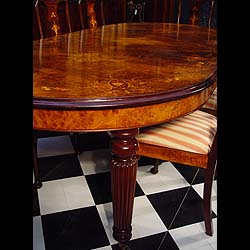 A 20th century Queen Anne style walnut and mahogany dining table    