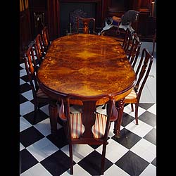 A 20th century Queen Anne style walnut and mahogany dining table    
