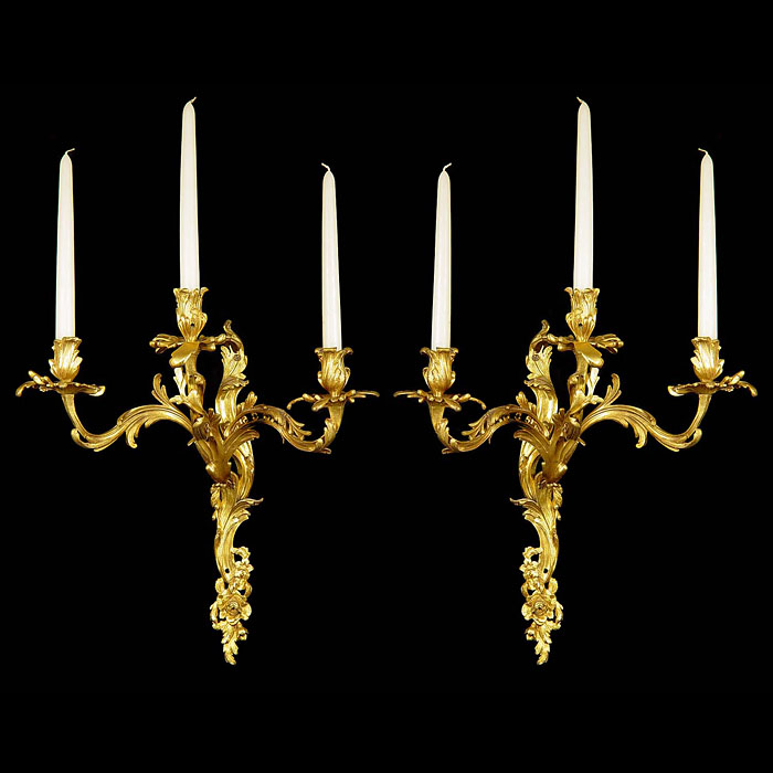 A pair of large Rococo style ormolu wall lights    