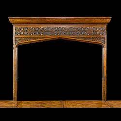 A Gothic Revival oak antique fireplace with Celtic patterned carving
