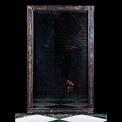 Antique Period Leather Framed Mirror with Original Glass
 A delightful Embossed Leather Surrounded Mirror with female masks and the Original Mercury Glass. English 19th century.
