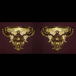 Antique Brass Wall brackets with scrolled Rococo decoration.
