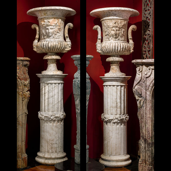 A pair of fine antique alabaster urns mounted on their original pedestals