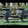 Pair of large antique cast iron garden urns.