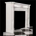 An antique Louis XVI style chimneypiece in statuary marble.