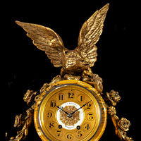 An antique Sienna and ormolu mantle clock