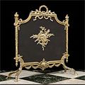 A French brass and mesh fire screen.