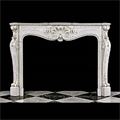 An antique Louis XV style fireplace mantel.