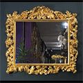 Antique English mirror, rococo in carved giltwood.