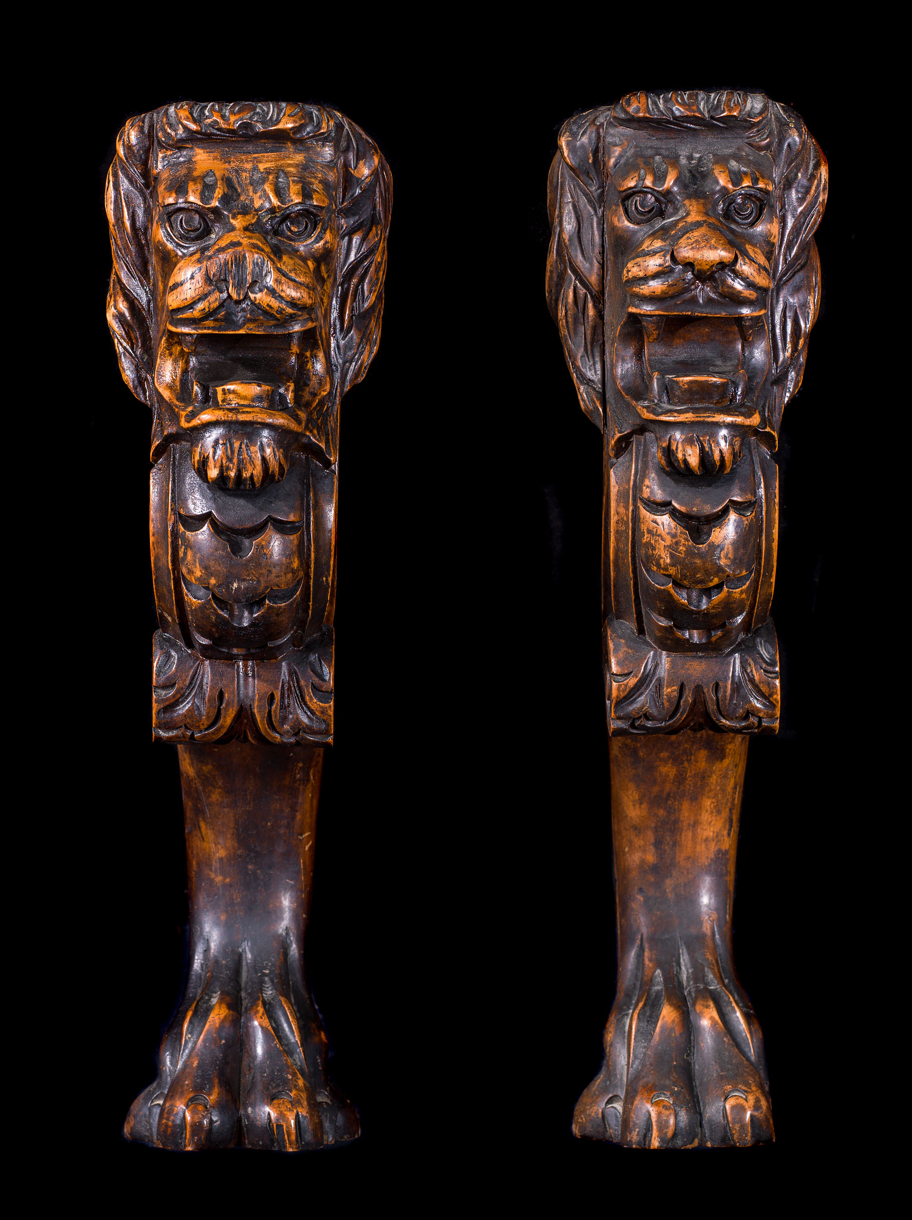 A pair of lion walnut monopodia terms
