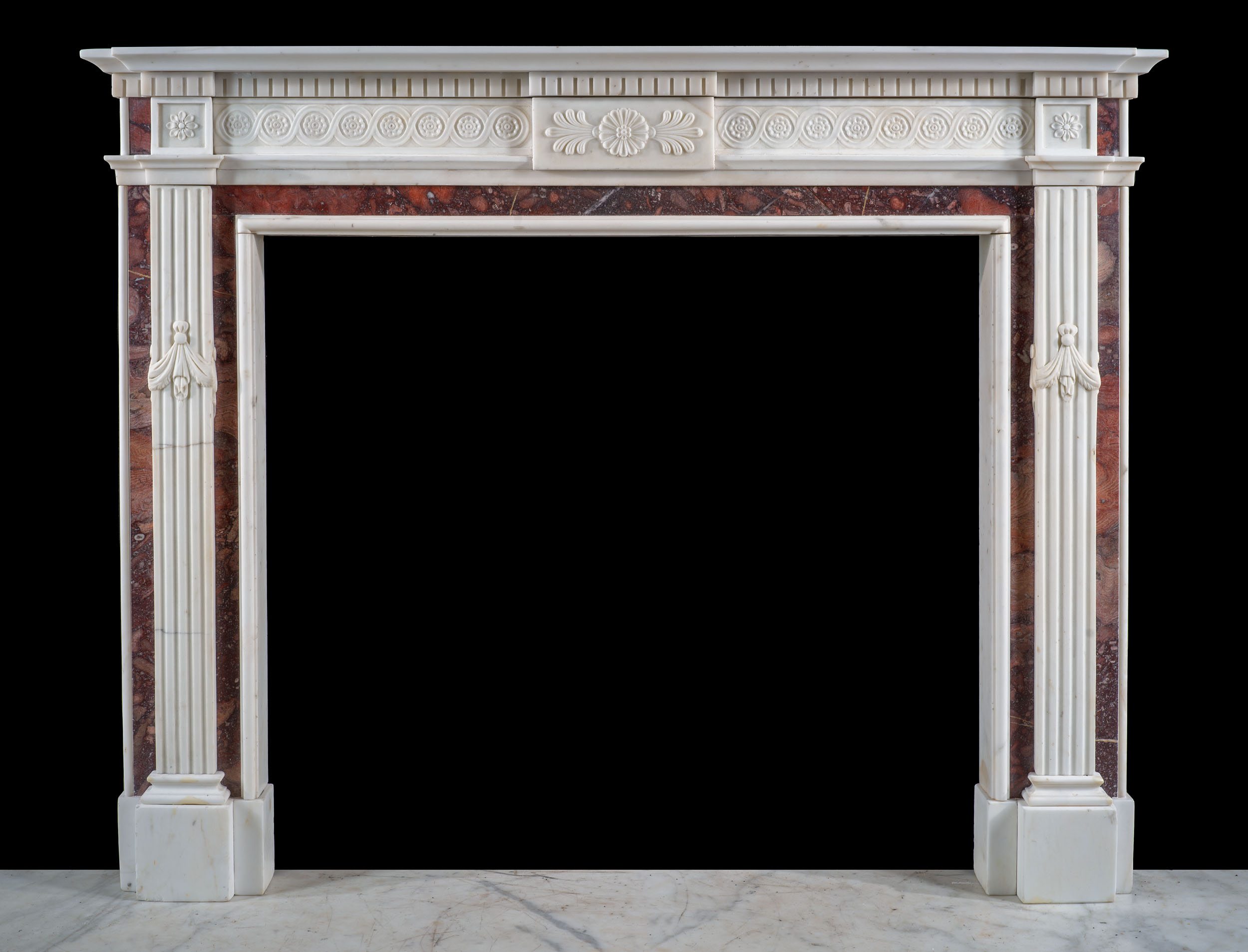A Neoclassical Style Statuary Fireplace